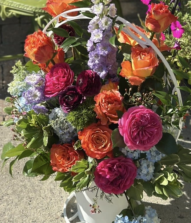 VIBRANT EMBRACE BASKET - STUNNING LARGE BASKET OF VIBRANT ROSES, HYDRANGEAS, DELPHINIUM, ORANGE/ BI COLORED ROSES, PURPLE RANUNCULUS, WAX FLOWER &amp; TRICK, WITH MIXED GREENS  PLEASE ALLOW AT LEAST 3 BUSINESS DAYS TO ENSURE WE HAVE THE BASKET AND ALL OF THE REQUIRED FLOWERS FOR THIS LARGE BASKET