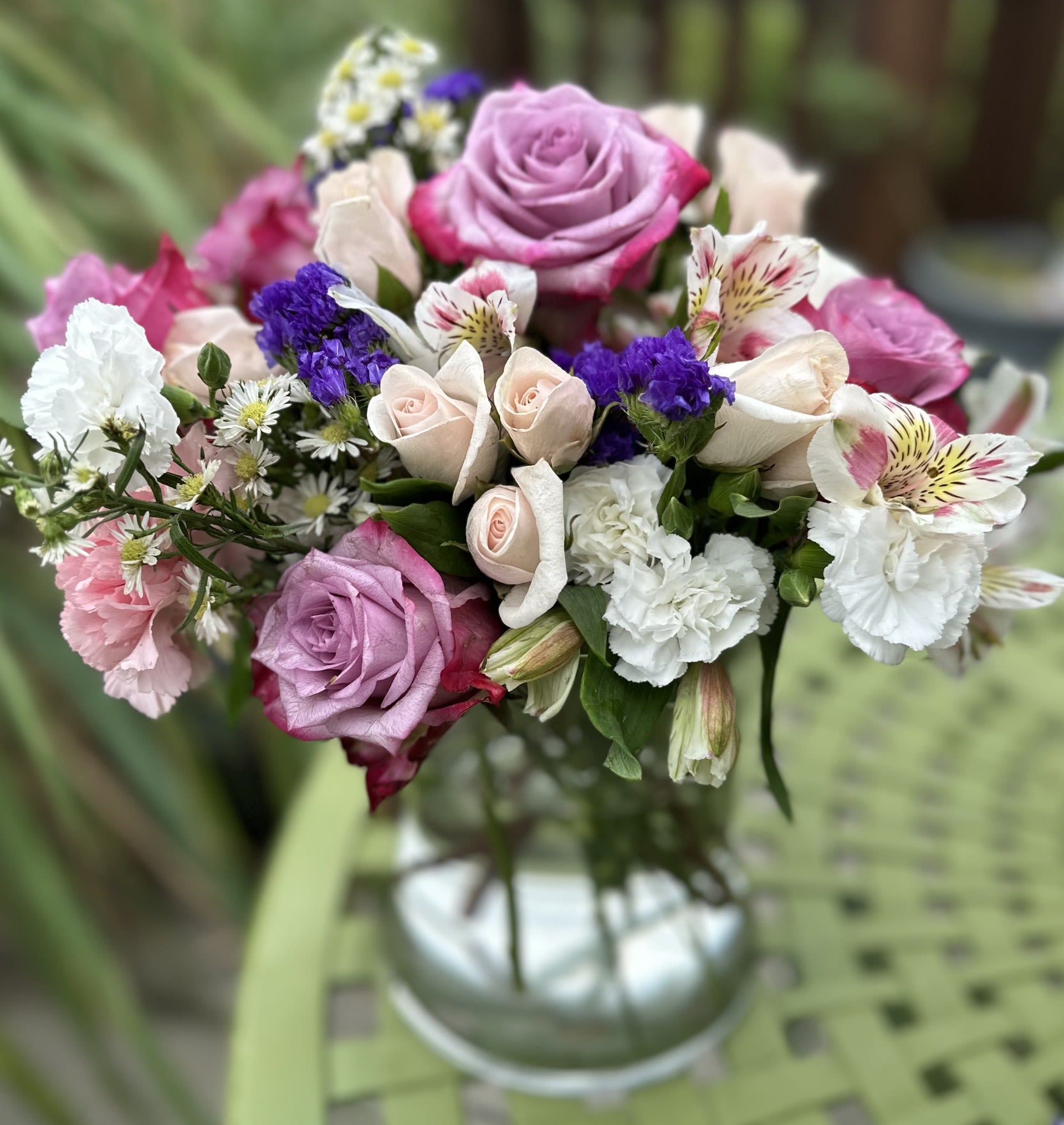 JUBILENT JOY CYLLINDER - LARGE CYLLINDER VASE FULL OF ROSES, SPRAY ROSES, CARNATIONS, MINI CARNATIONS, ALSTROMERIA, AND GREENS