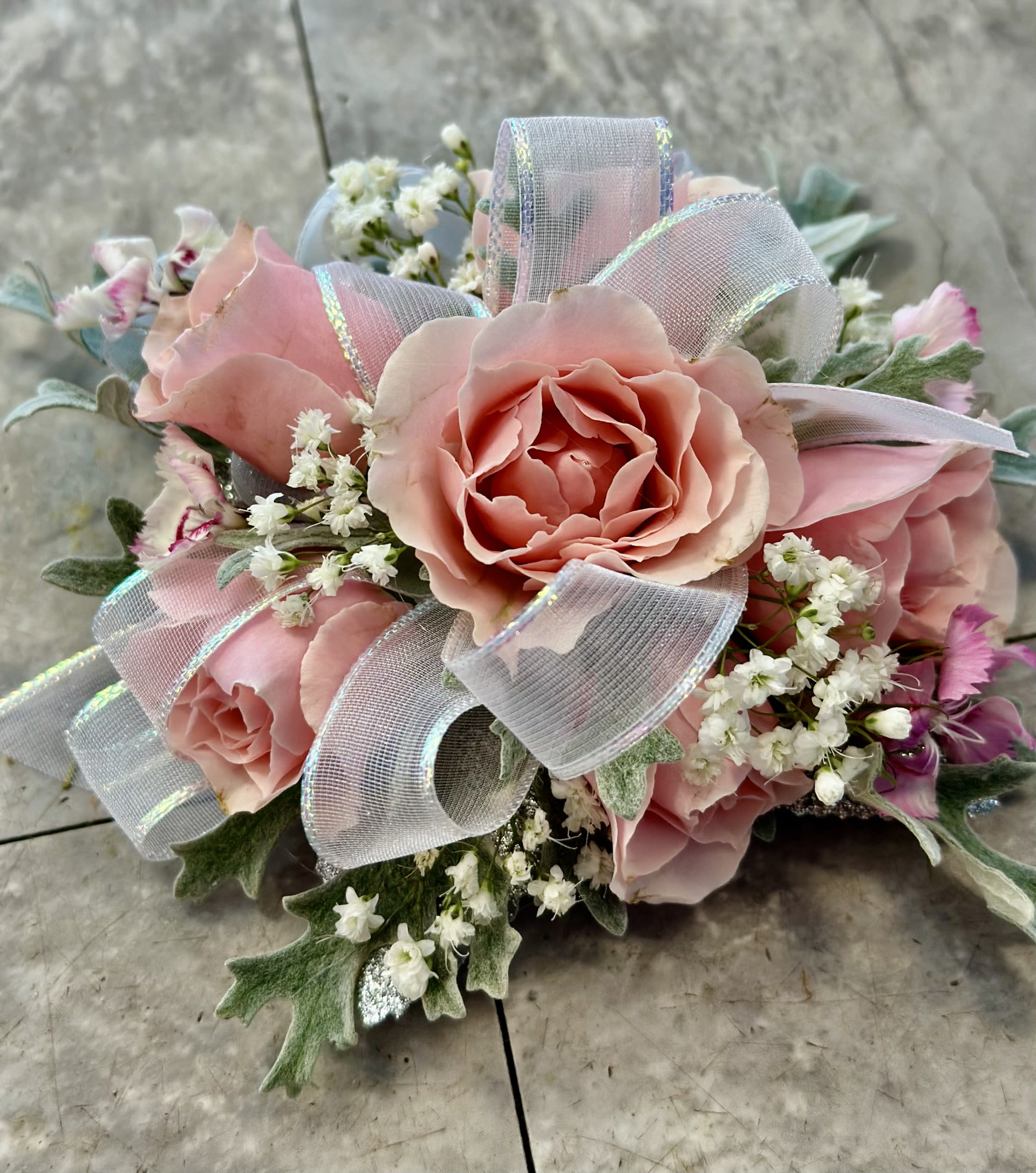 Pink rose bouquet with white filler flowers and sheer ribbon