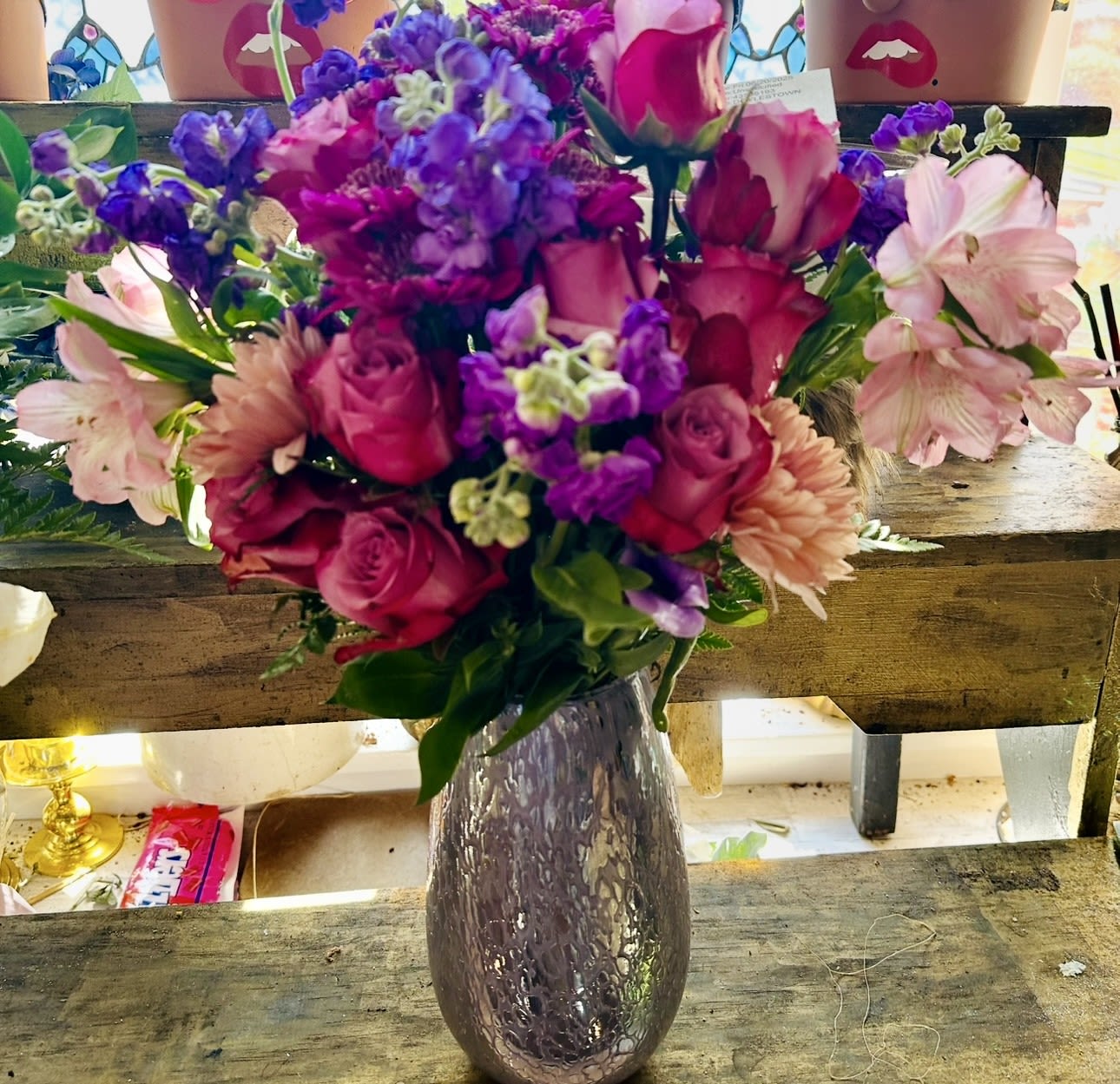 PURPLE PLEASURES BOUQUET - STUNNING BOUQUET OF PURPLE ROSES, ALSTROMERIA, STOCK, MUMS IN A PURPLE STUNNING ART VASE. WOW FACTOR!!