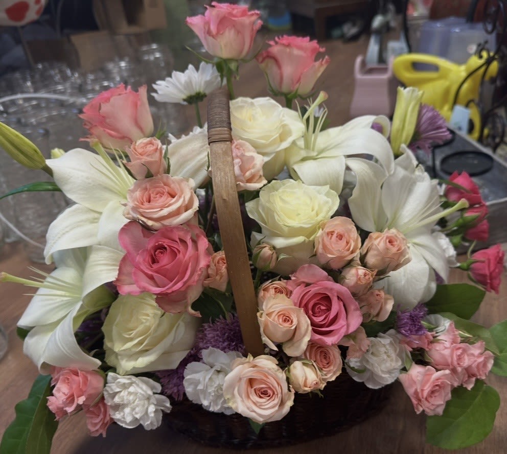 PINK PARADE BASKET - EQUISITE BASKET OF LILIES, ROSES, SPRAY ROSES , MINI CARNATIONS, MUMS AND DAISIES. WOW FACTOR!!