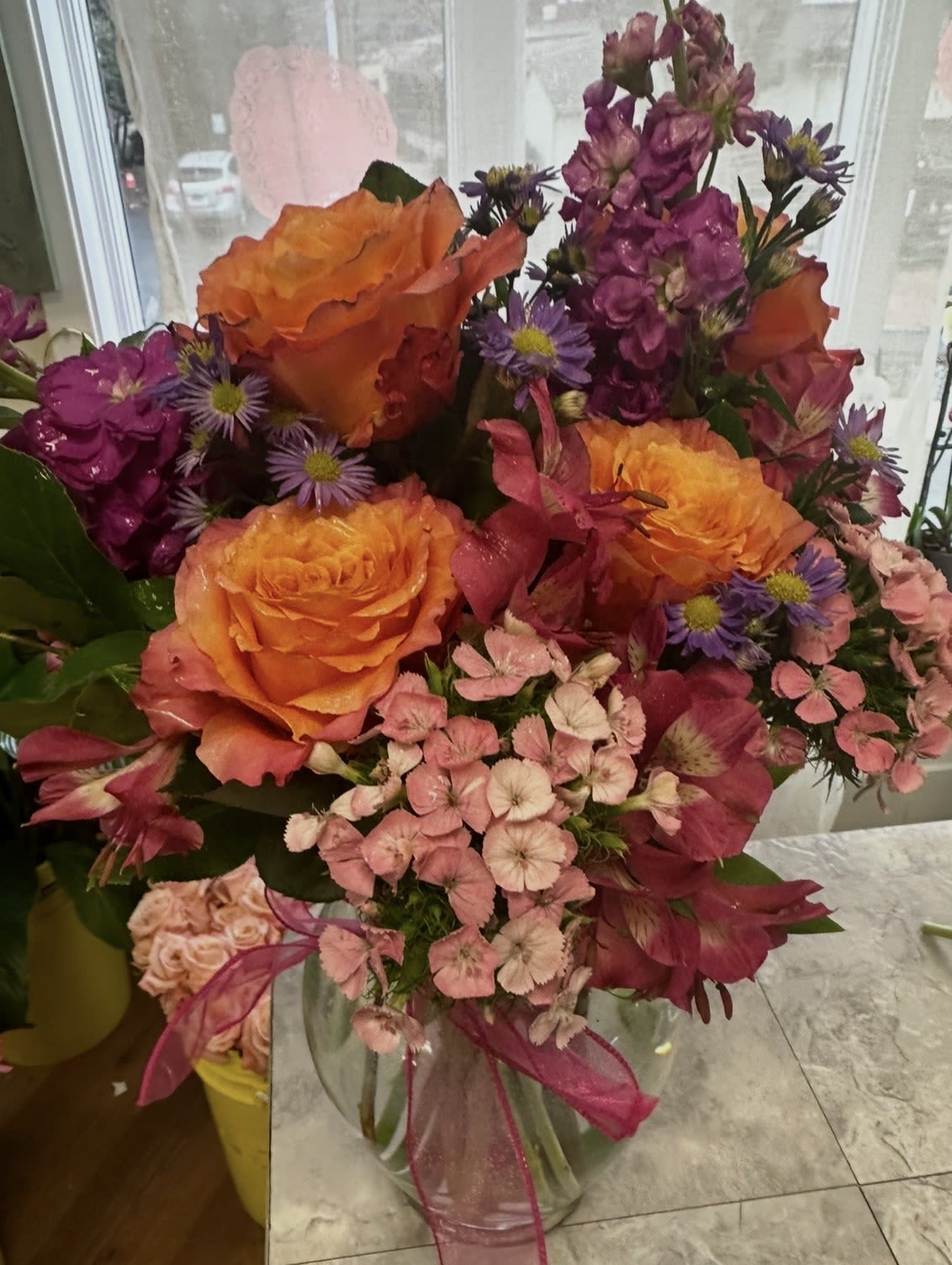 KALEIDASCOPE BOUQUET - STUNNING COLOR COMBINATIONS OF ORANGE, PINKS, AND PURPLES!! FREE SPIRIT SCENTED ROSES, SWEET WILLIAM. STOCK AND ASTERS MAKE THE PERFECT COLOR COMBINATION!