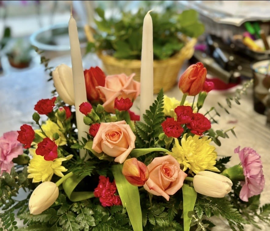 TULIP SURPRISE CENTERPIECE - BEAUTIFUL EASTER CENTERPIECE CONTAINING  CANDLES, TULIPS, MINI CARNS, ROSES, MUMS WITH GREENS. BRING THE BEAUTY OF SPING TO YOUR TABLE 