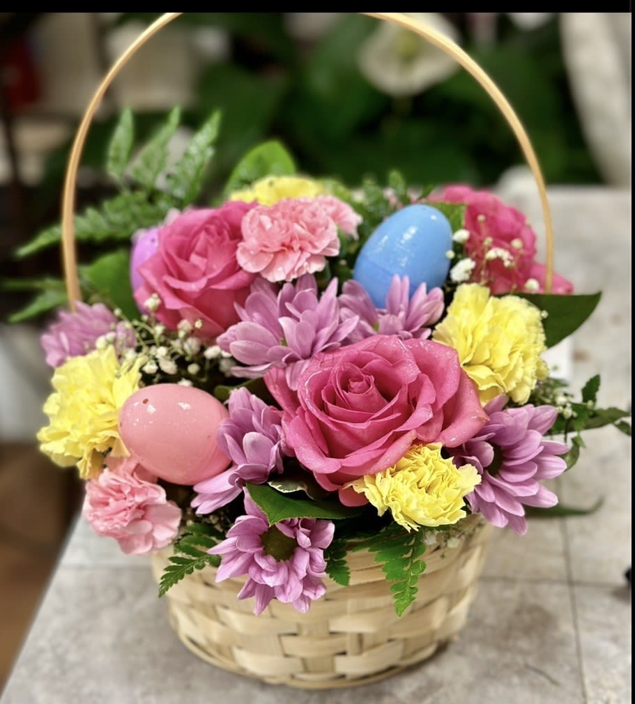 POP OF SPRING EASTER BASKET - CUTE BASKET OF PLASTIC EGGS, ROSES, DAISIES, CARNATIONS AND FILLERS. SURE TO BRING A HOLIDAY SMILE