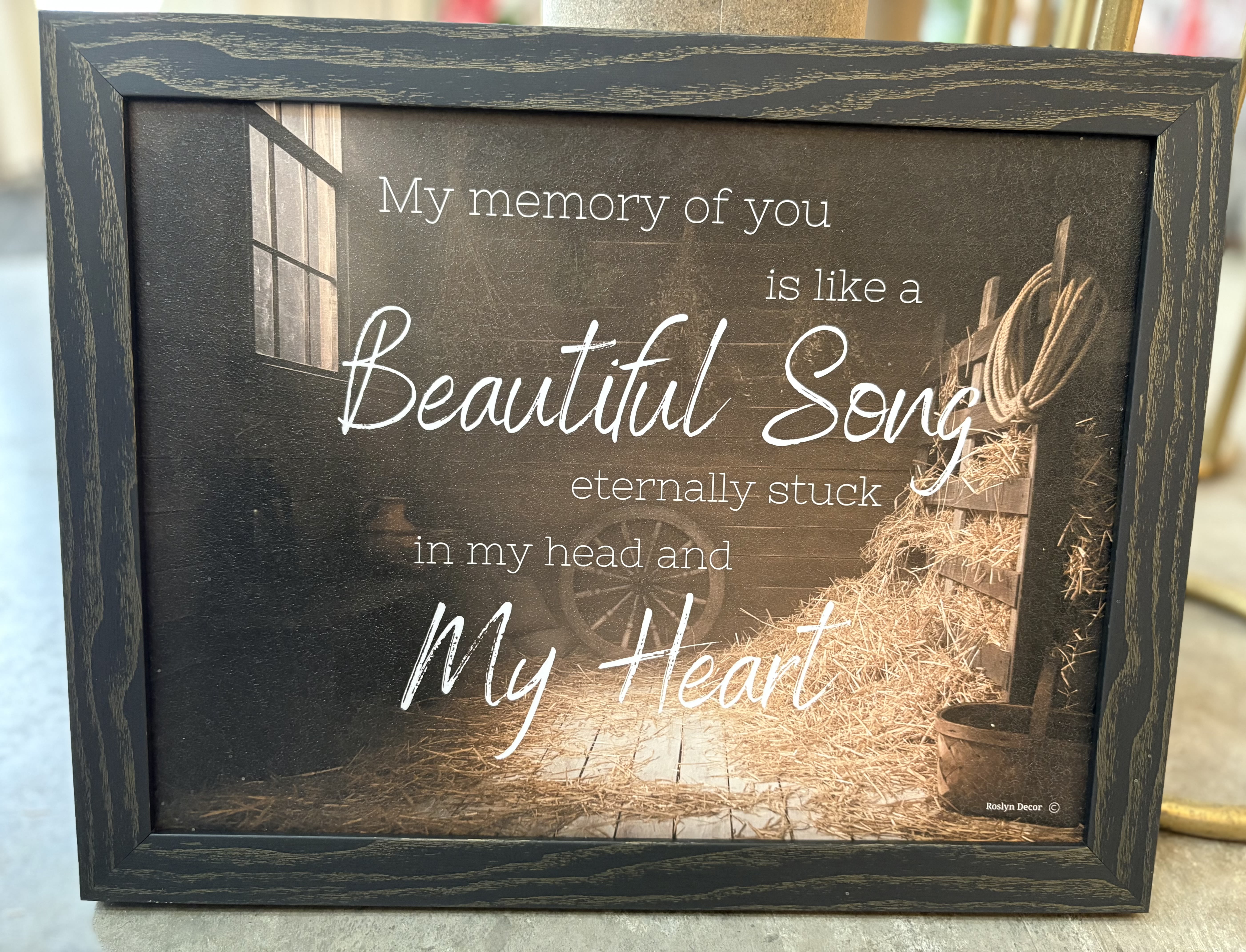 Framed memorial sign with the words "My memory of you is like a Beautiful Song"
