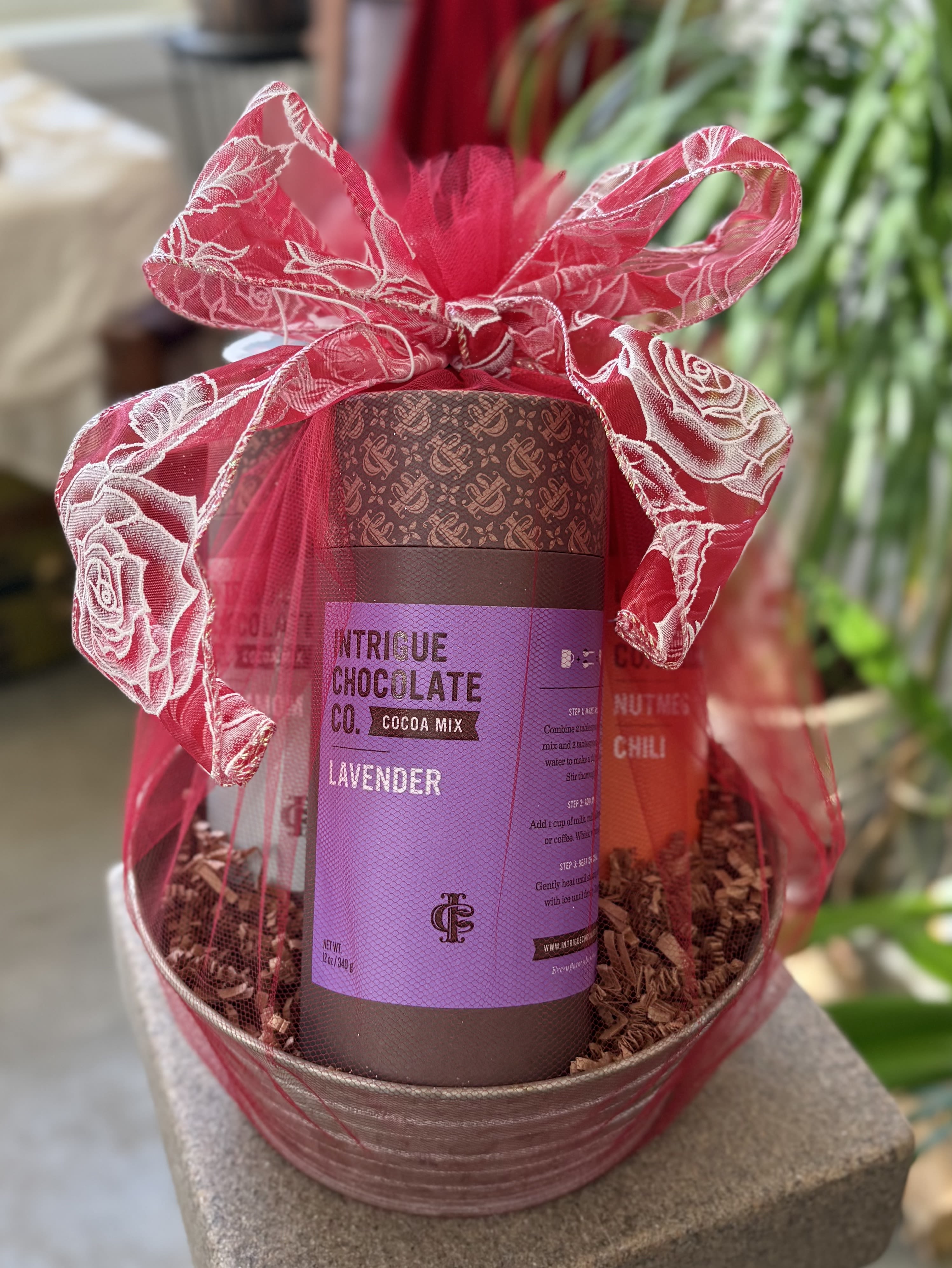 Gift basket with cocoa mix and a pink ribbon bow