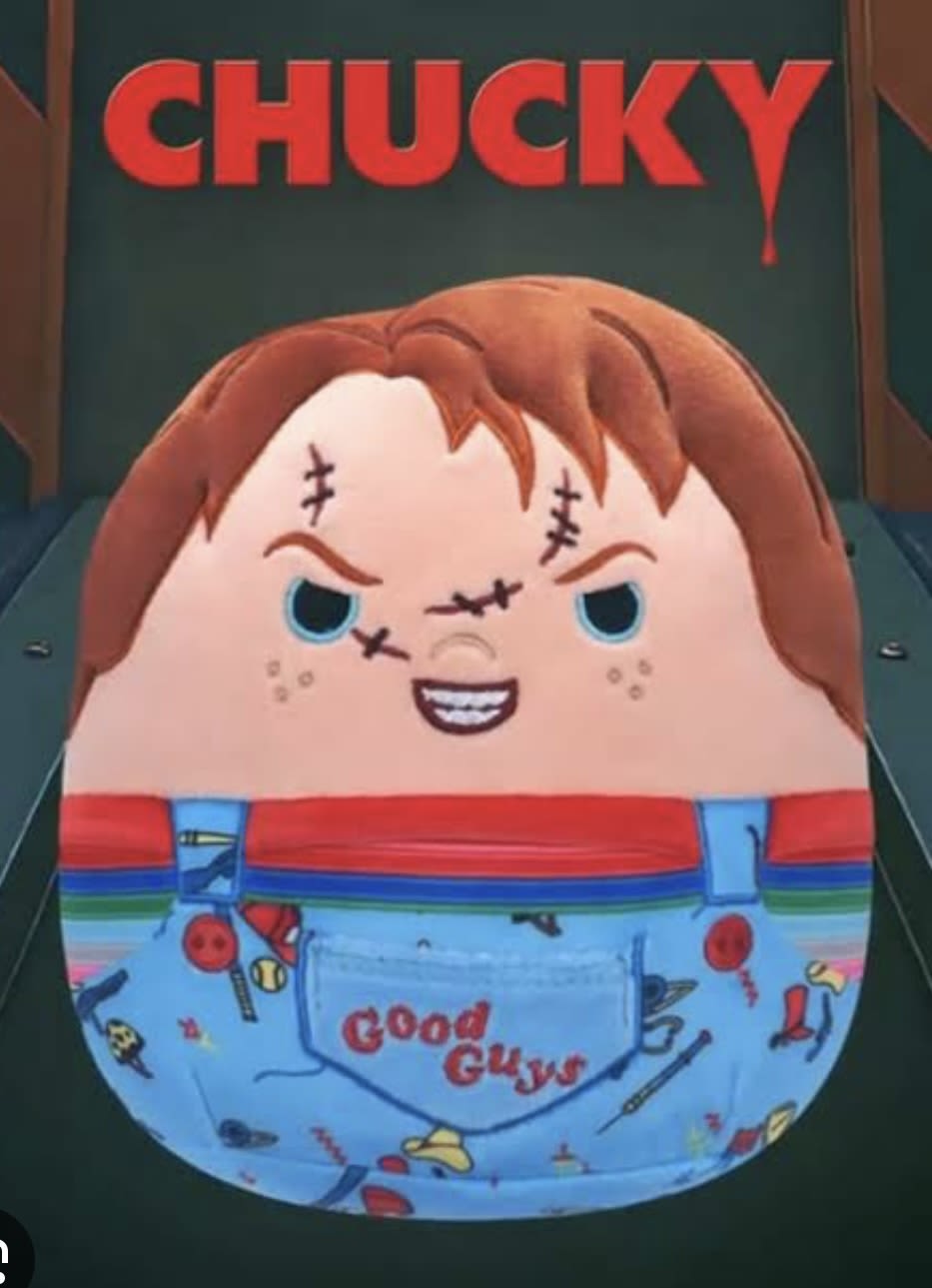 Decorative cake shaped like Chucky in overalls