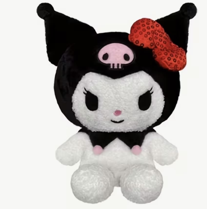 Black-and-white plush character with a red bow