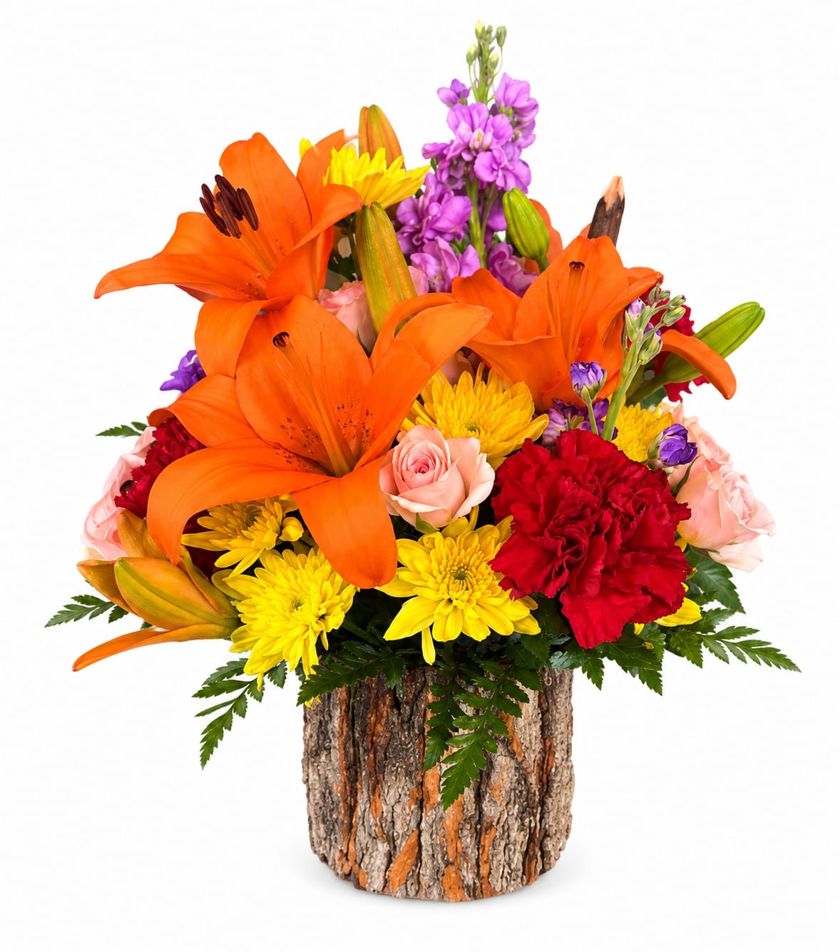 Orange lilies, yellow mums, pink roses, and red carnations in a bark-covered container