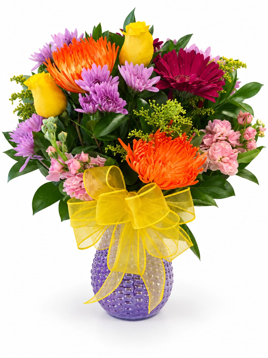 Colorful bouquet of mixed flowers in a purple vase with a yellow bow