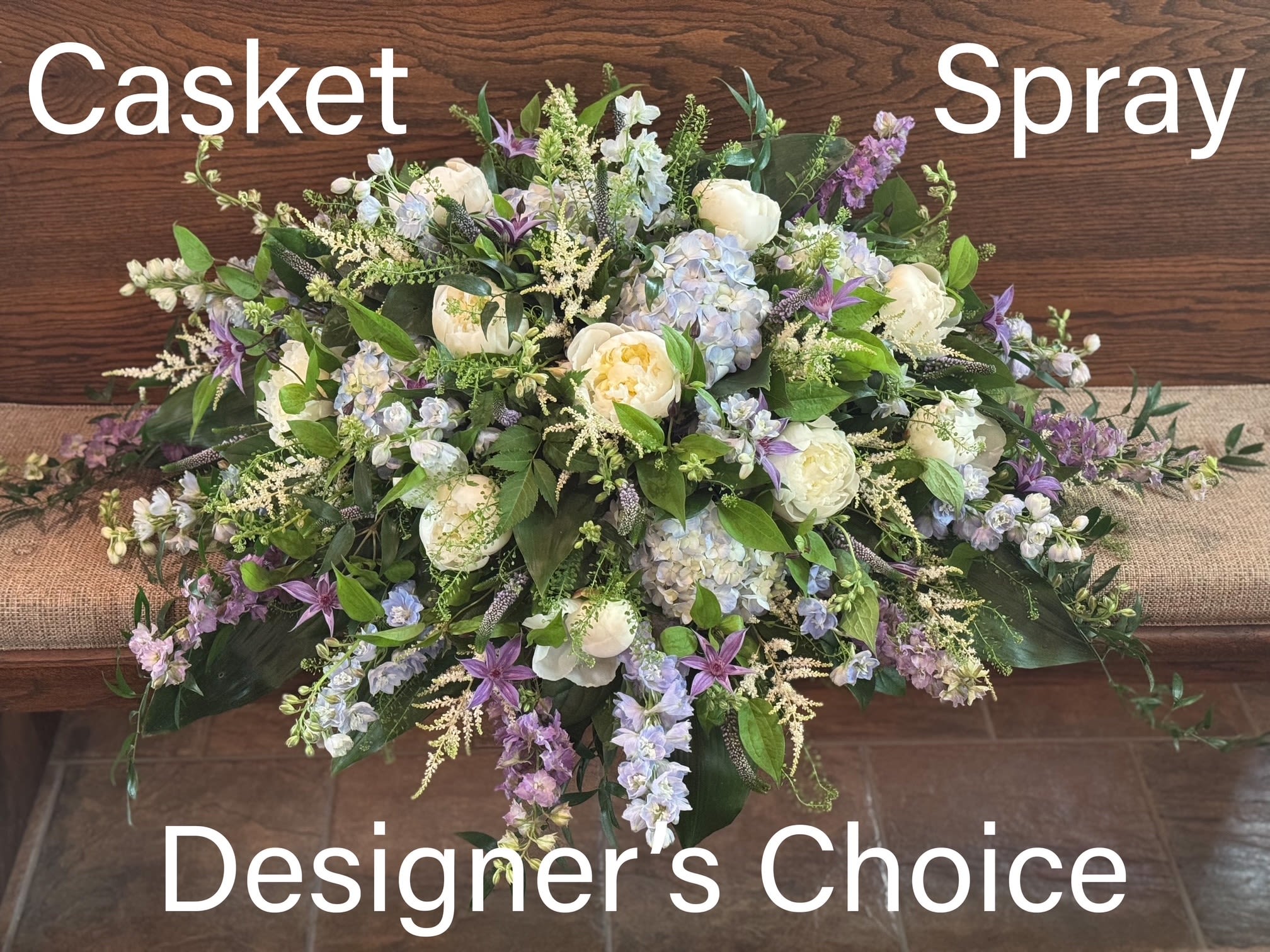 Large casket spray with white and lavender flowers