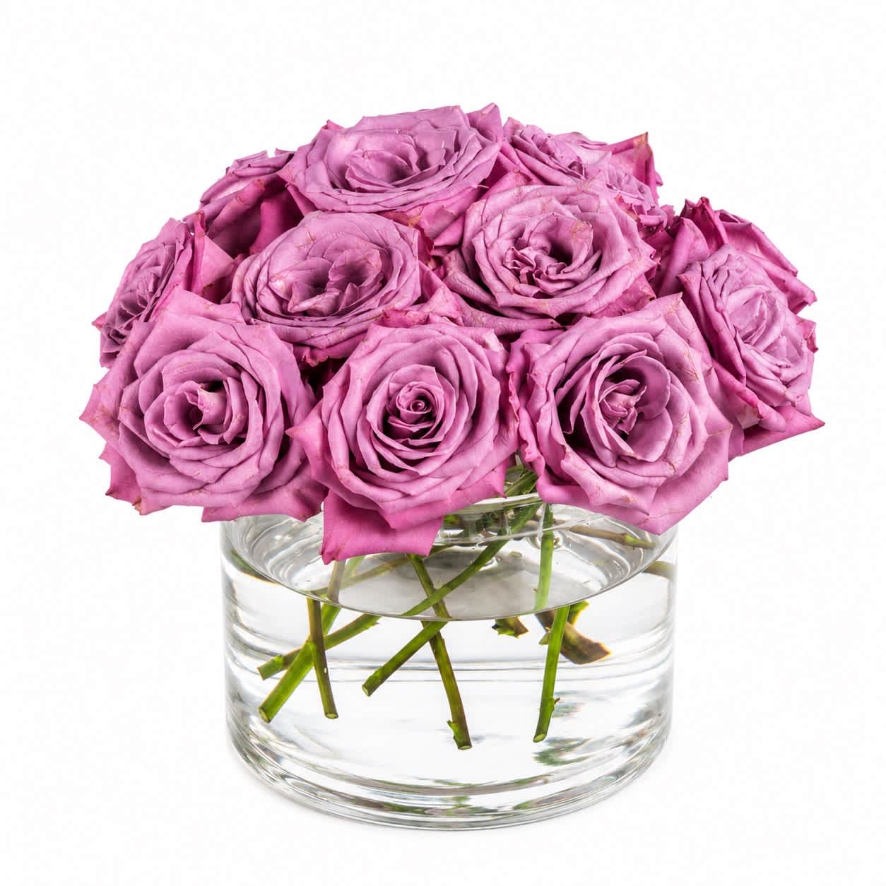 Pink roses arranged in a clear glass vase