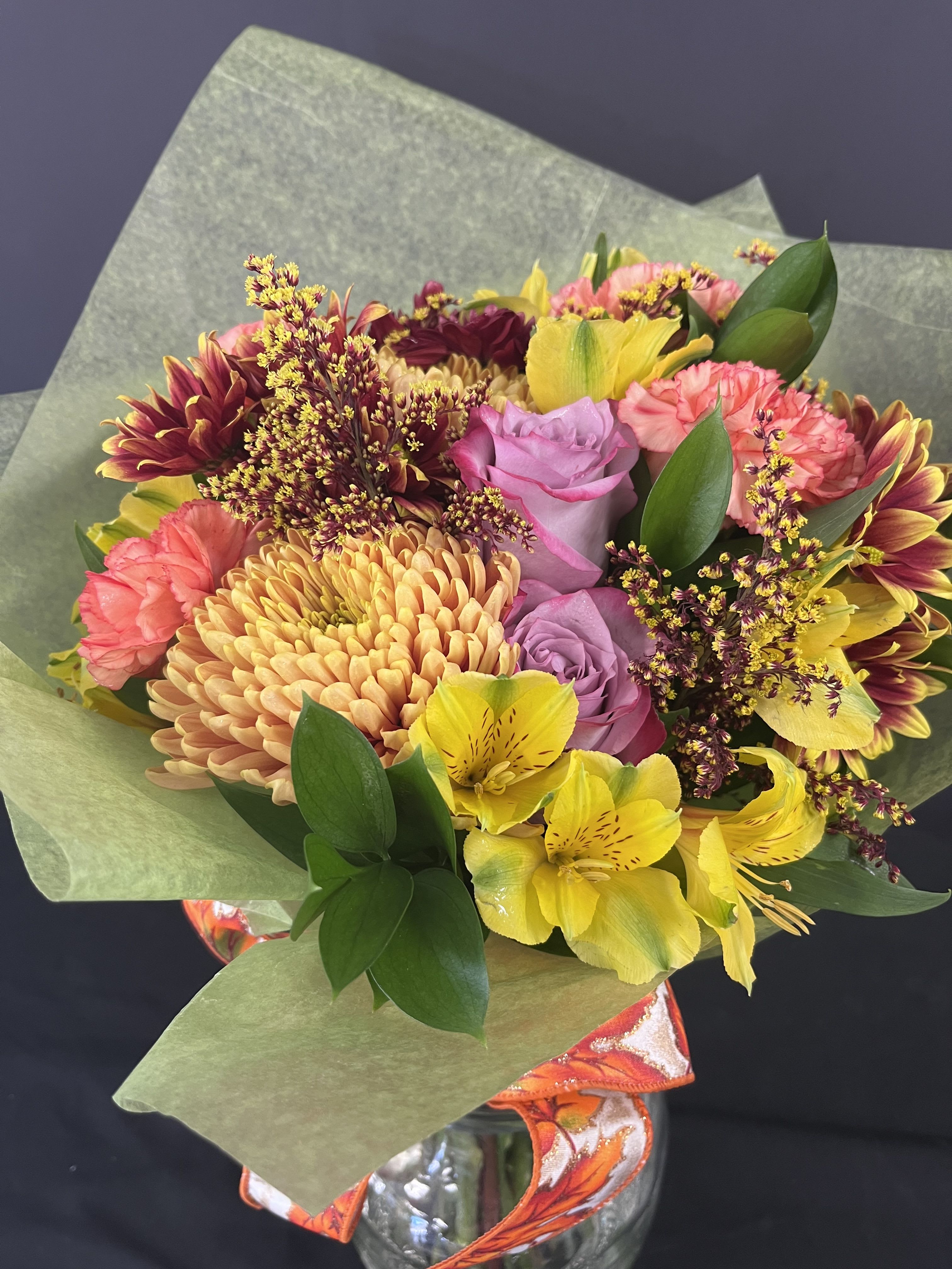 Beautiful Harvest Wrap - Stunning blooms fill our harvest wrap. Comes  in bright colored wrapping sent with a sponge for hydration until delivery.