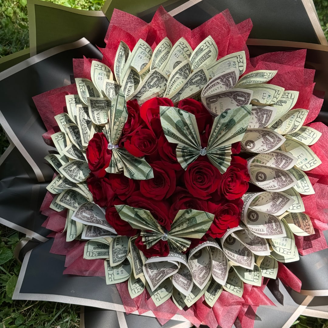 Bouquet of red roses with folded dollar bills and black wrapping
