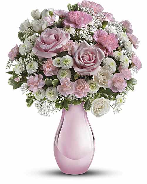 Pink and white rose bouquet in a pink glass vase