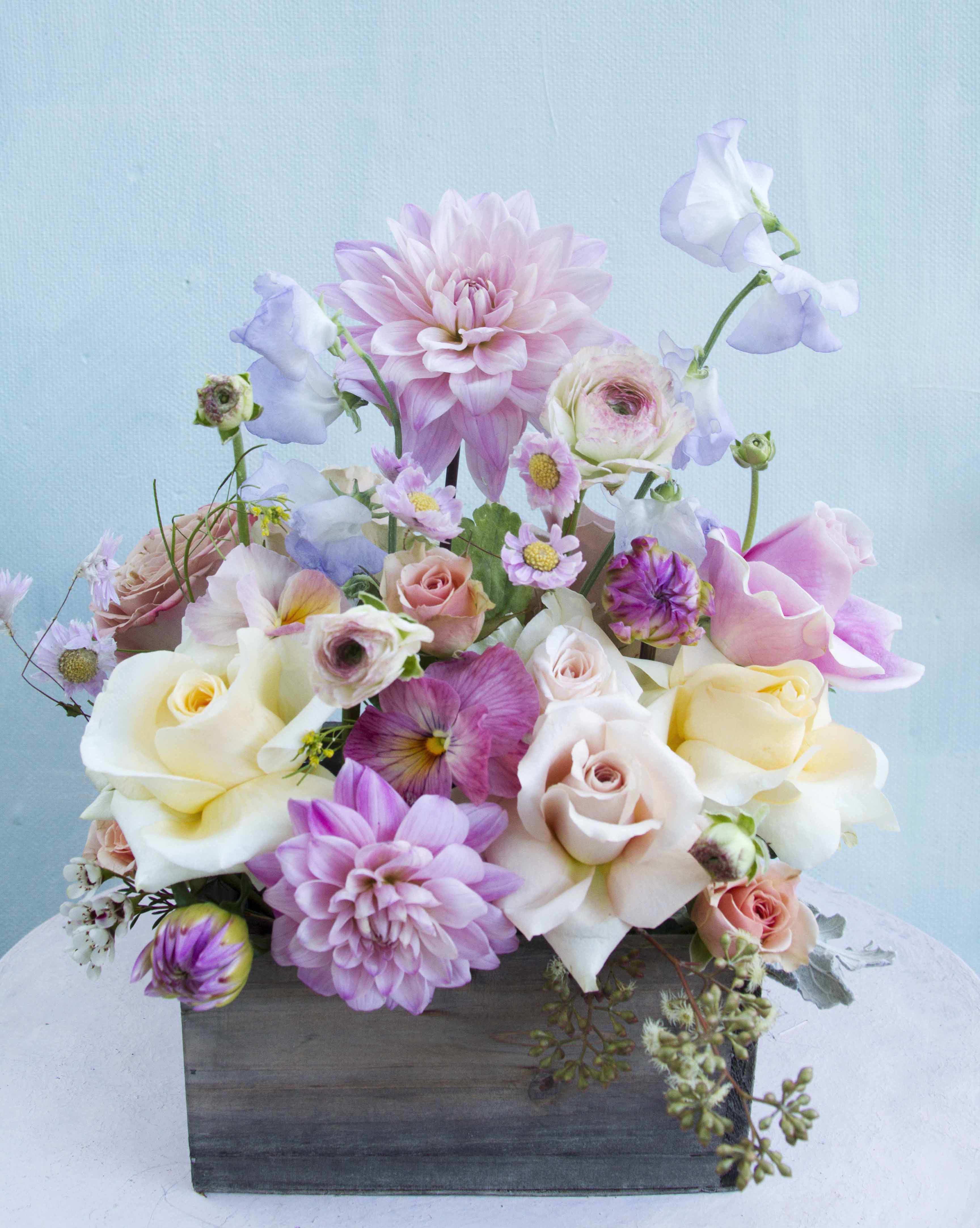 Molly Flower box - Adorable box of dreamy pastel flowers, with the feel of a flower meadow, light and feminine. Soft pastel, classic color palette of natural stems that rise up in this small wooden box  (5.5" by 5.5" and 4" tall) full of very pretty flowers like sweet peas, ranunculus, roses and sesaonal stems. Upgrade to Deluxe or Premium for a fuller and richer arrangement with more stems. Blomst LA only uses fresh, high quality flowers, all carefully selected every day to fit your flower order.  We offer a personal hand delivery by our own delivery staff and guarantee the flowers will look perfect, when they arrive.