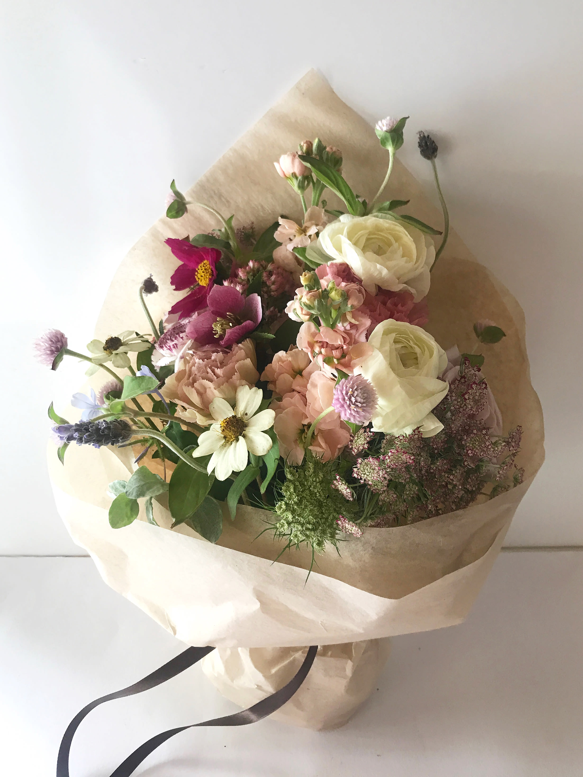 The LA bundle - A bundle of stems carefully selected, as natural and beautiful looking as possible, as if they had just been picked on a field. With a small amount of greens and stems of seasonal flowers like poppies, ranunculus, lavender, corn flowers, peonies or whatever cuteness is in season. 15 stems, 30 or 60 stems wrapped in beautiful silk paper with ribbon. We offer a personal hand delivery by our own delivery staff and guarantee the flowers will look perfect, when they arrive. 