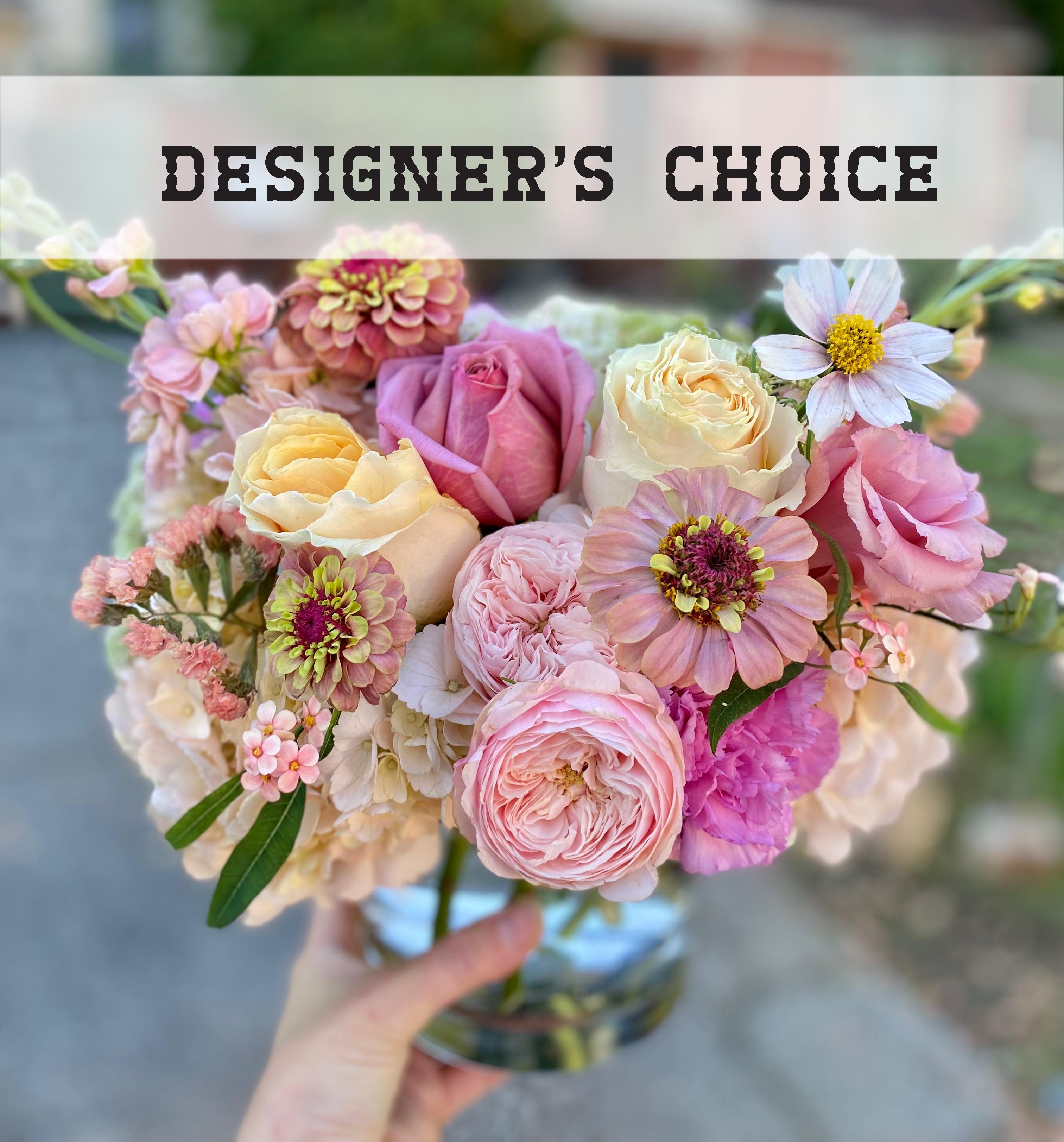 Pastel bouquet of roses and mixed blooms in a glass vase