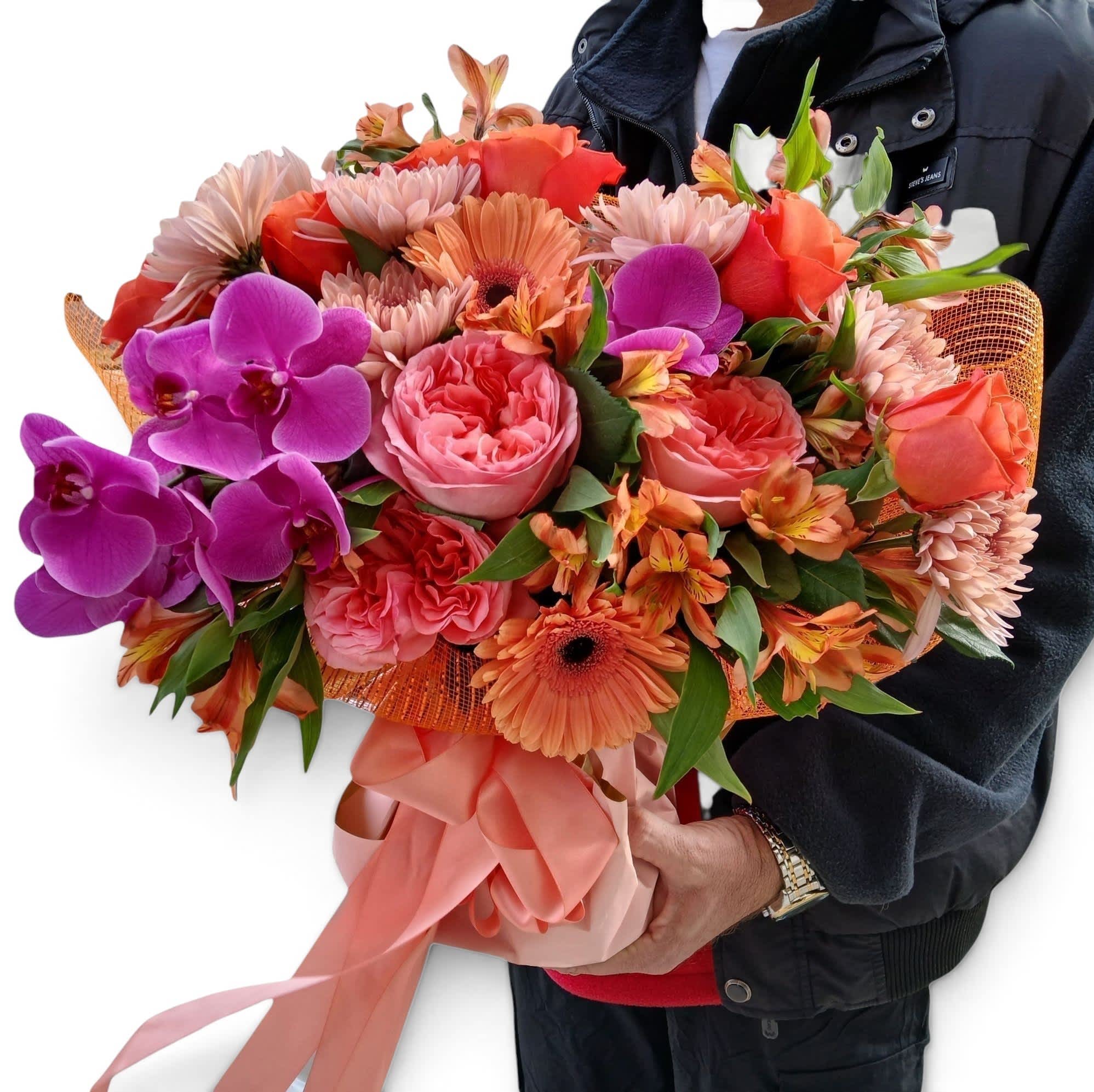 Large bouquet of pink, orange, and purple flowers wrapped with a satin ribbon