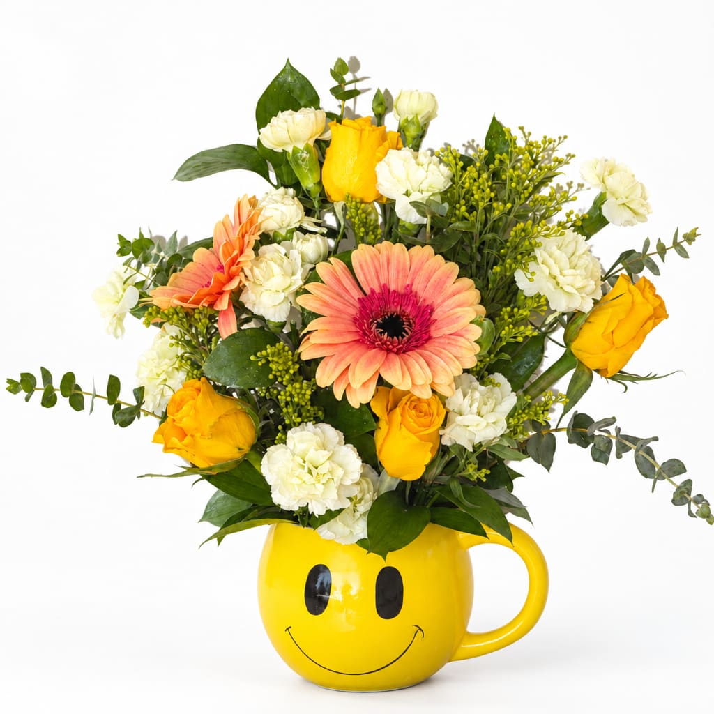 Mixed bouquet in a yellow smiley-face mug vase