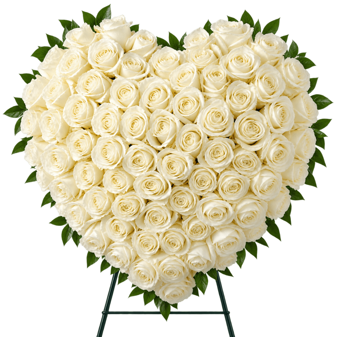Heart-shaped arrangement of white roses on a stand