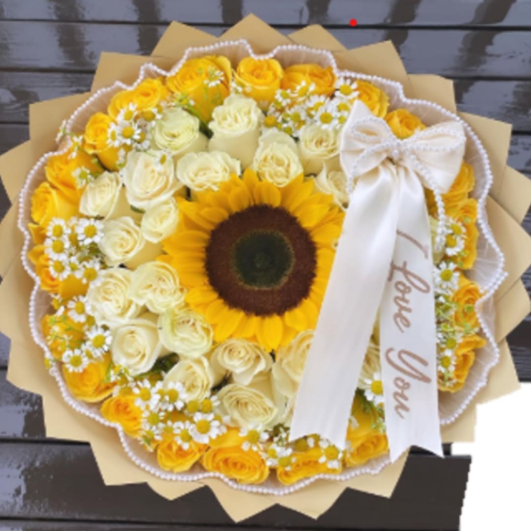 Round bouquet of yellow and cream roses with a sunflower center and white ribbon