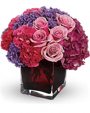 Fantasy Found - If you know someone whose fantasies might include something found on a tropical island, you've found their perfect arrangement. Gorgeous yellow cymbidium orchids and leucadendron, red gladioli, lily grass and other tropical greens are delivered in a distinctive keepsake bamboo cube. This gift's a natural. 