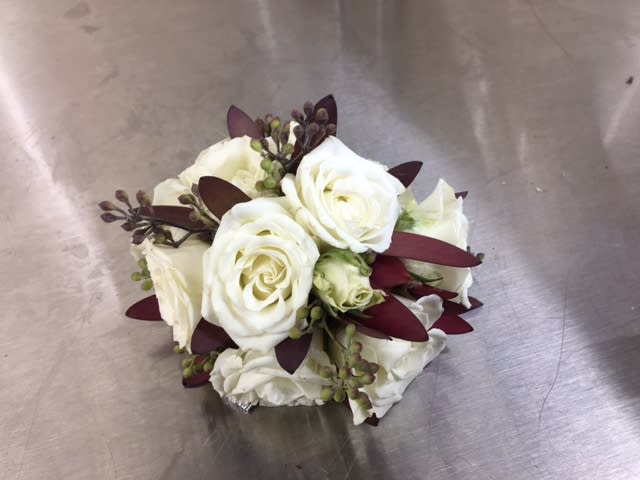 White rose bouquet with dark burgundy accents