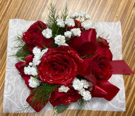Red rose bouquet with white baby's breath and a red ribbon