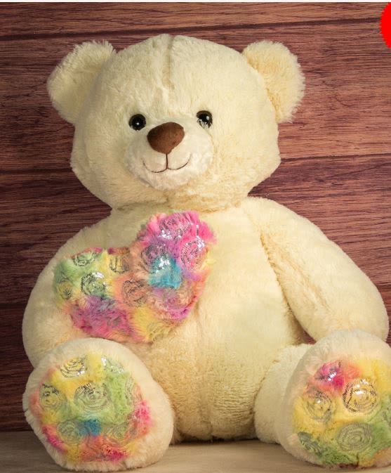 Cream teddy bear with colorful floral-patterned paws and chest