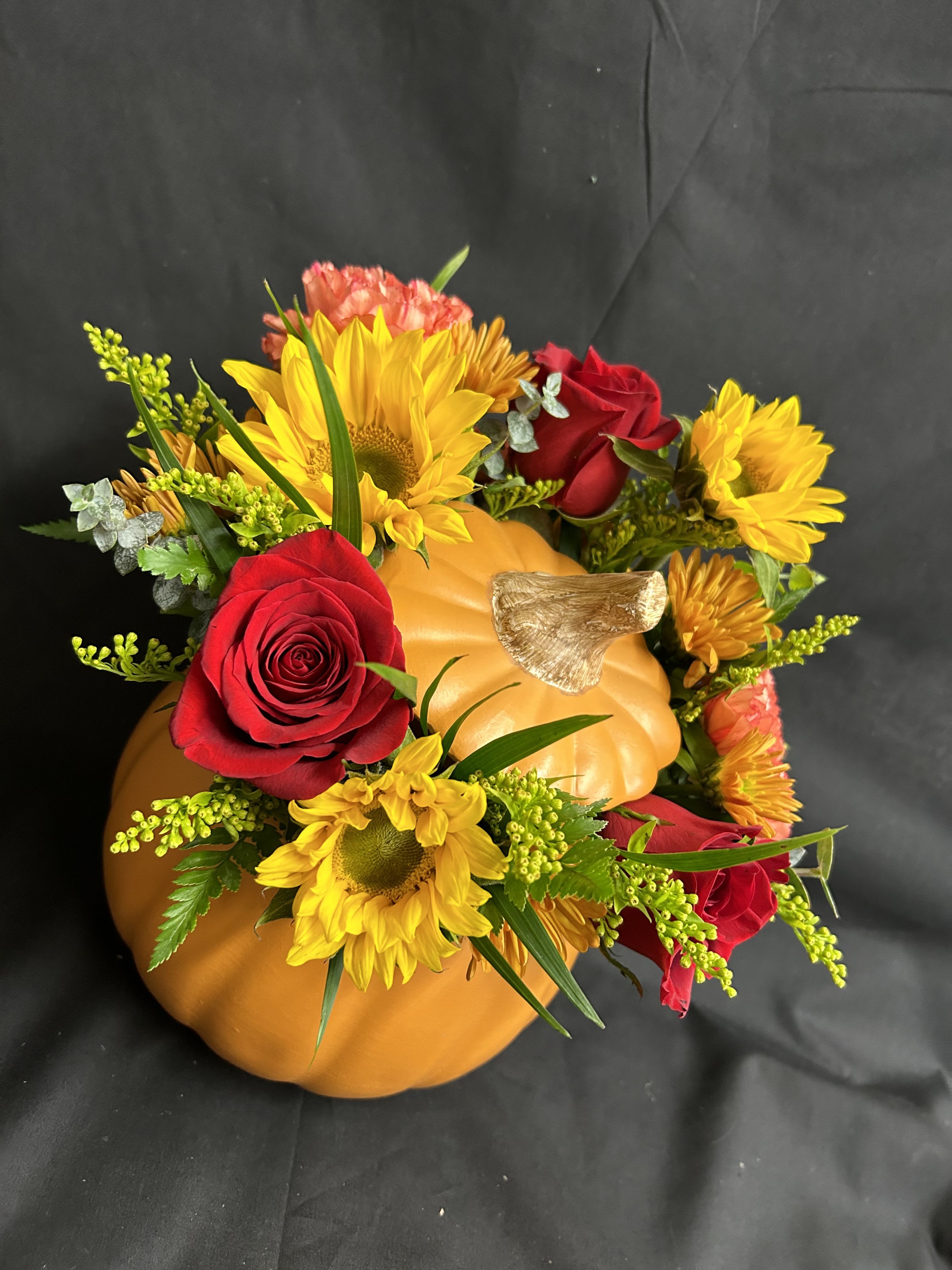 Pumpkin Patch - Unique and different? Why not send your loved one a arrangement in a pumpkin vase? Perfect for the center of your table at your family feast or just to remind someone you're thinking of them during the holiday