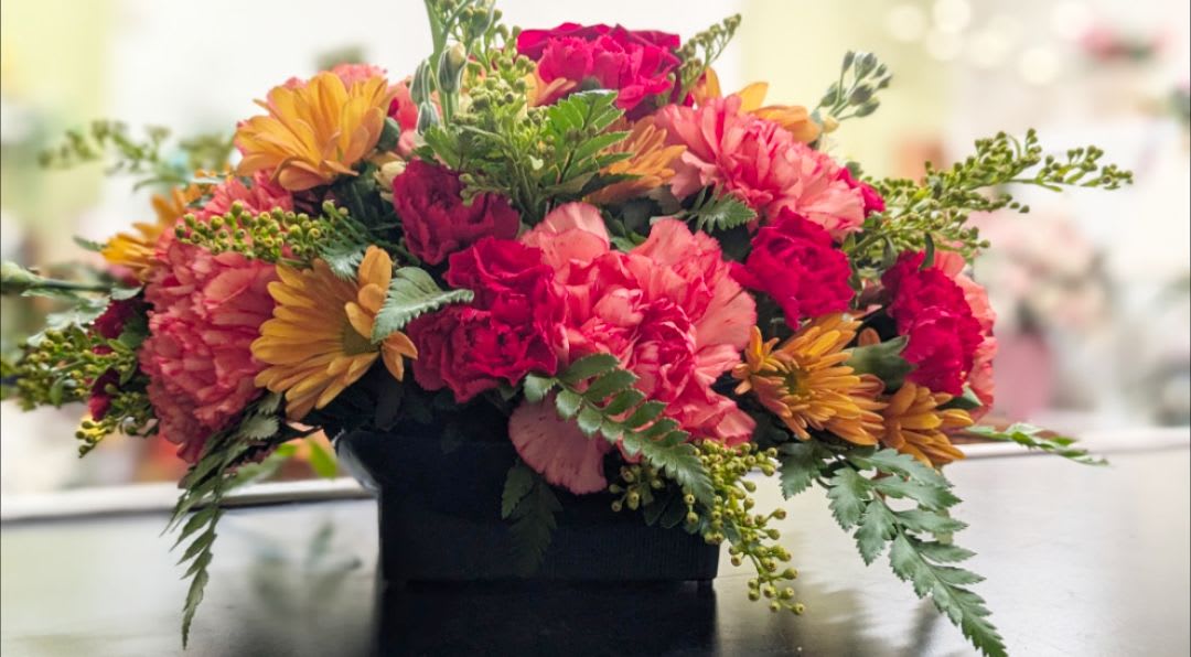 Round centerpiece  - Let our designers create a round centerpiece perfect for your table. Centerpiece is guaranteed to have a variety of fall colored flowers and greenery.  *photos are samples, flower types are subject to change*
