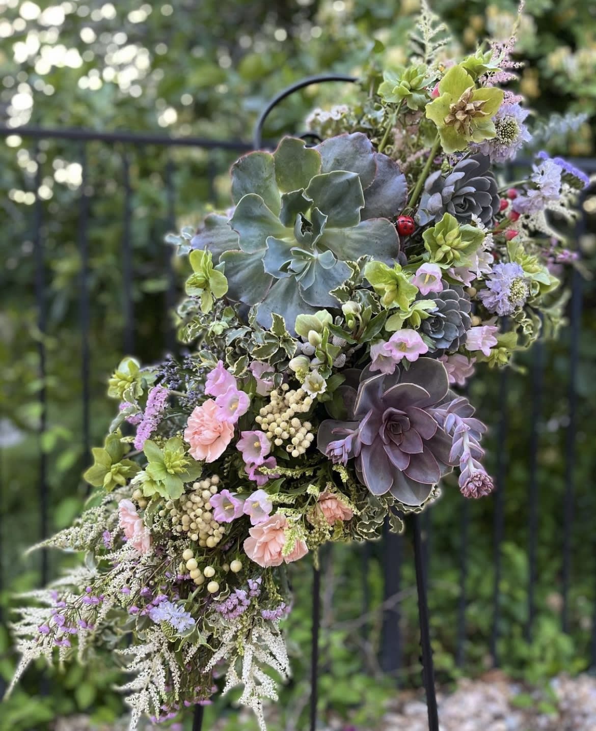 Succulent bouquet with pastel flowers and berries