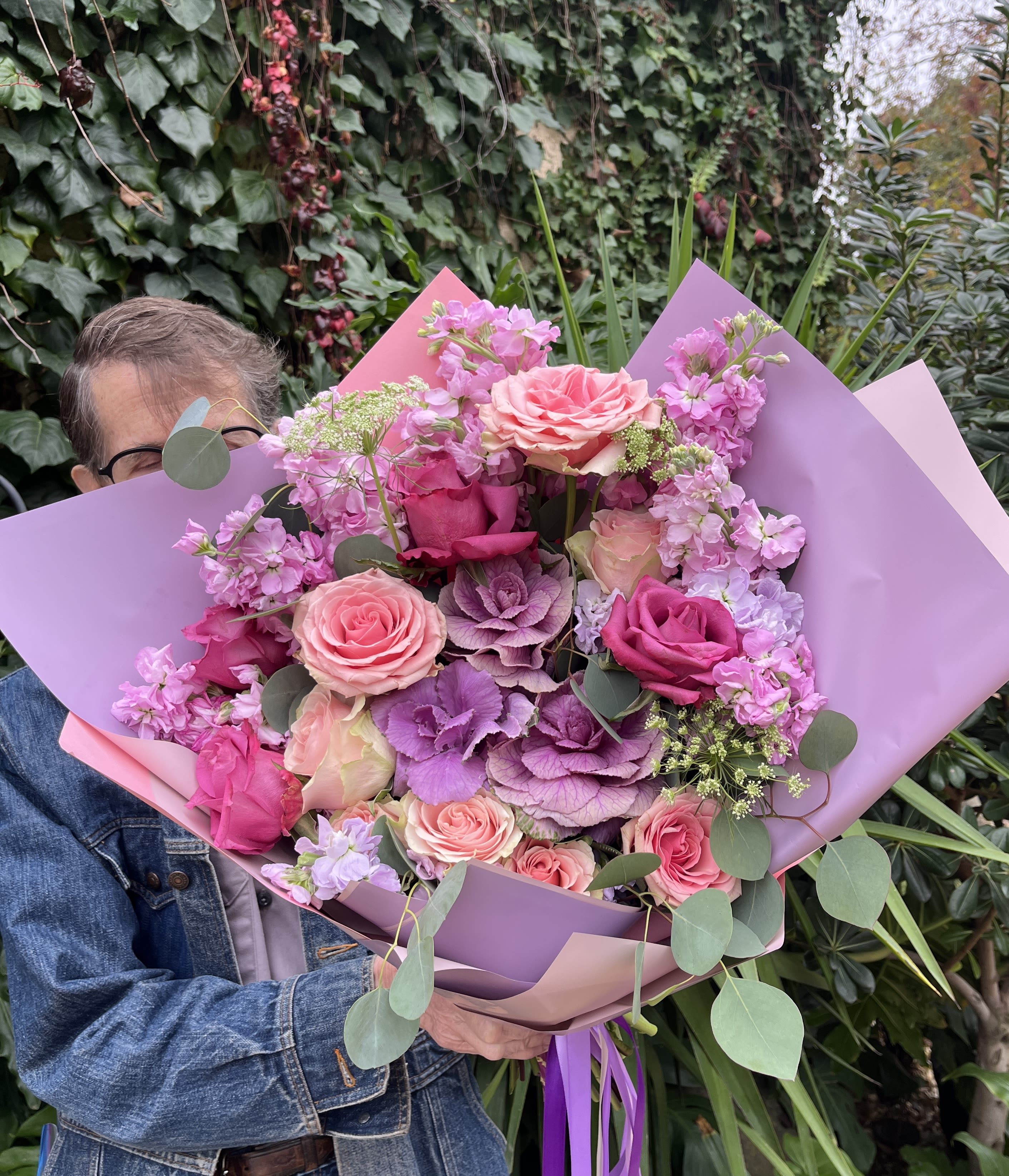 Large pink and purple bouquet with roses and wrapped paper