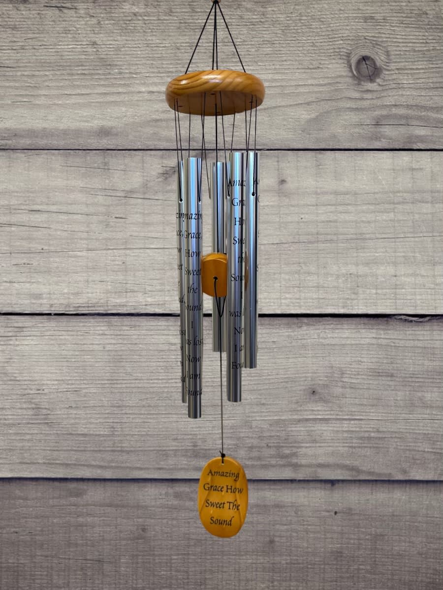 Hanging silver wind chime with a wooden top and yellow accent pieces