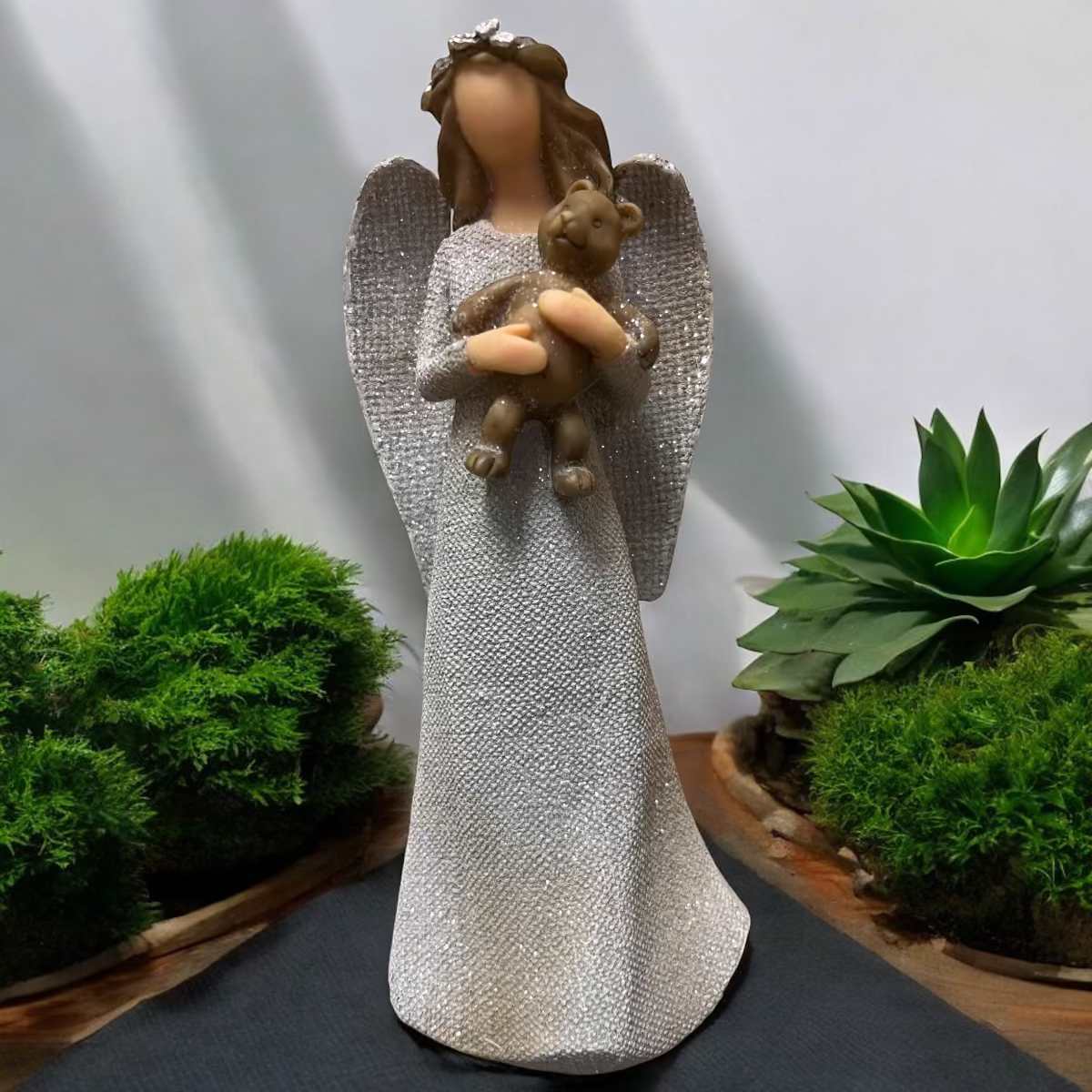 8" Angel Holding Bear - A beautiful resin angel makes a sweet and memorable gift by itself or in a beautiful arrangement.