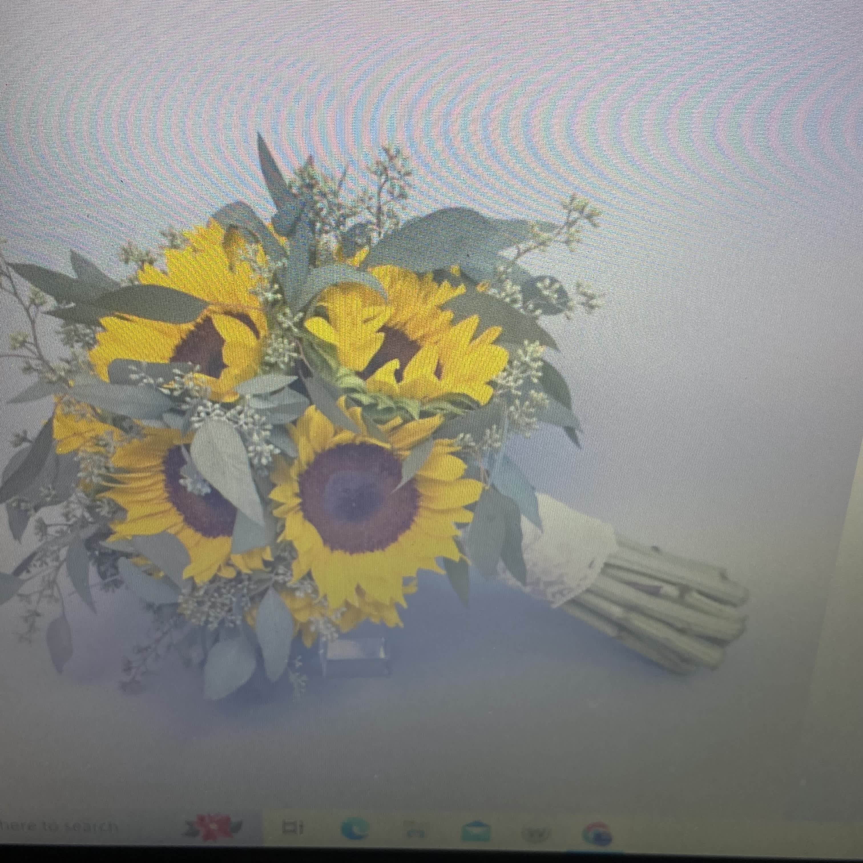 Bouquet of yellow sunflowers with pale greenery and white filler
