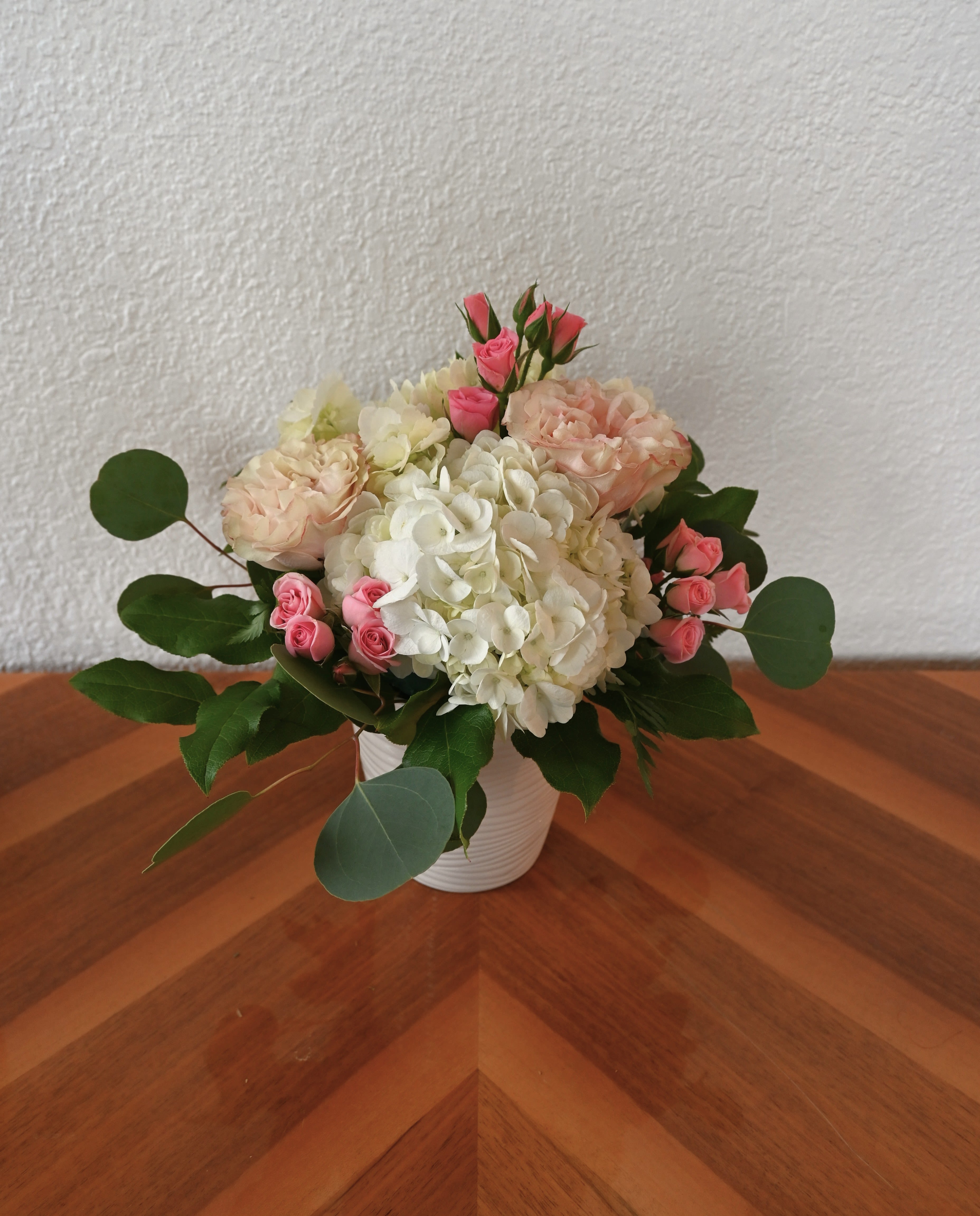 Sweet Sentiments - This comforting combination of pink roses and white hydrangea exudes warmth and love, making it the perfect gift for expressing heartfelt messages.  Sweet Sentiments is an ideal arrangement for anniversaries, birthdays, new babies, or simply to show you care.