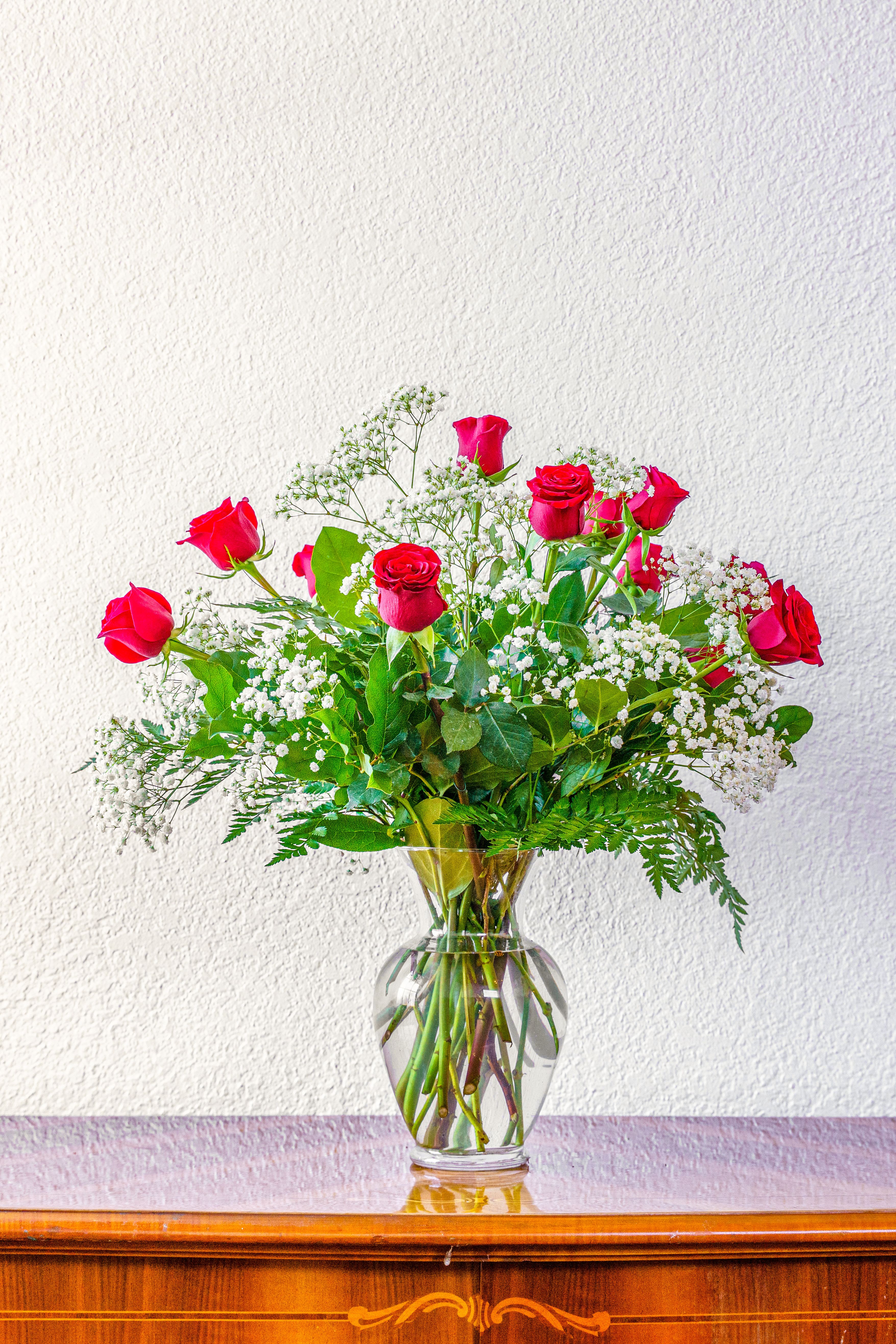 Dozen Red Roses - A dozen red roses is truly the most classic way to express love and romance. Send her a gift that will leave her speechless! Our dozen red roses comes with baby's breath to take it over the edge!