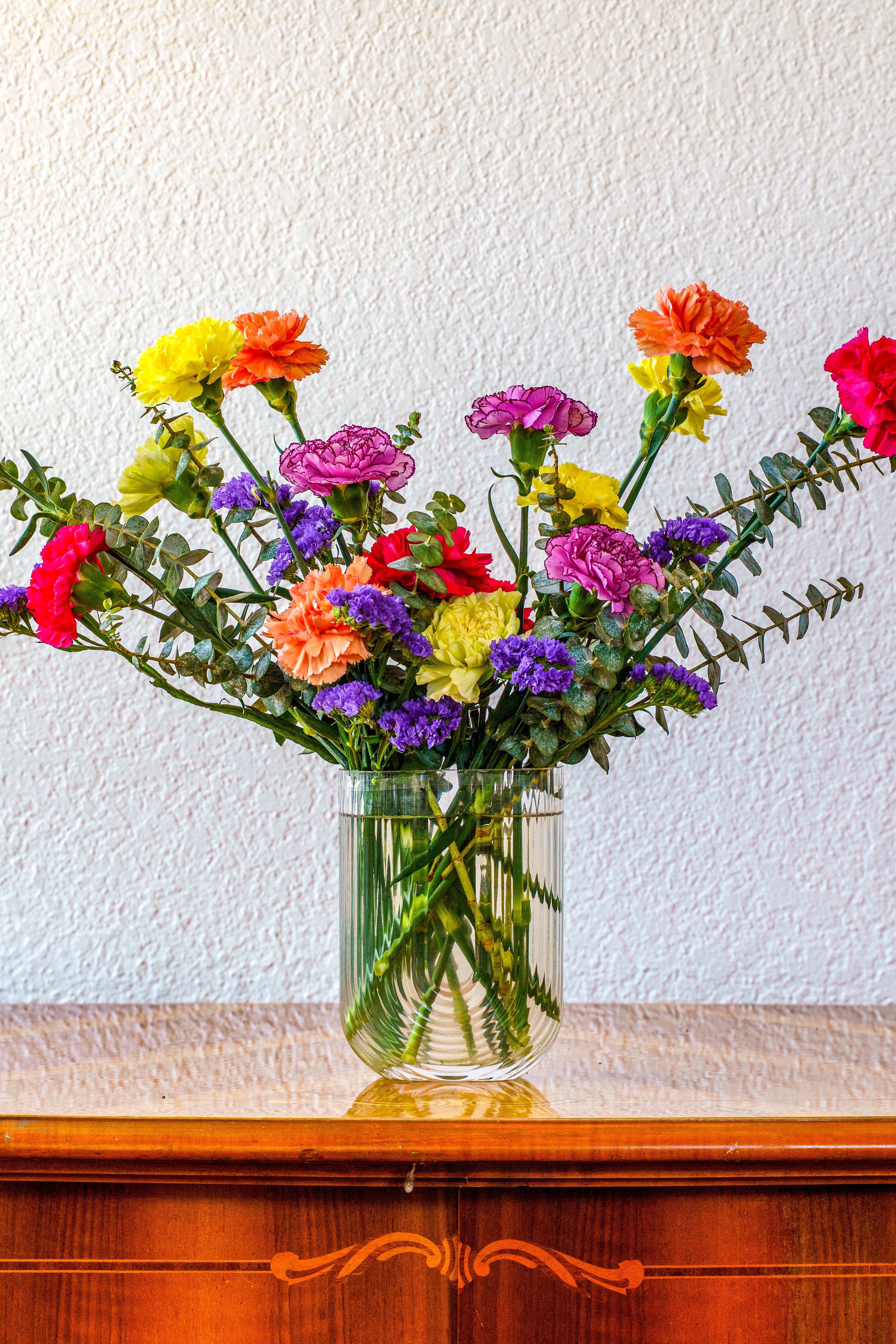 Groovy Blooms - Send them this groovy display of carnations in a sweet retro vase! This playful array of colorful blooms is the perfect way to let them know how cool they are, or just let them know you're thinking of them.