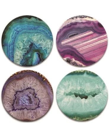 Set of four round coasters featuring colorful agate-inspired patterns in teal, purple, and pink.