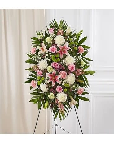 Standing floral spray with pink and white flowers on an easel