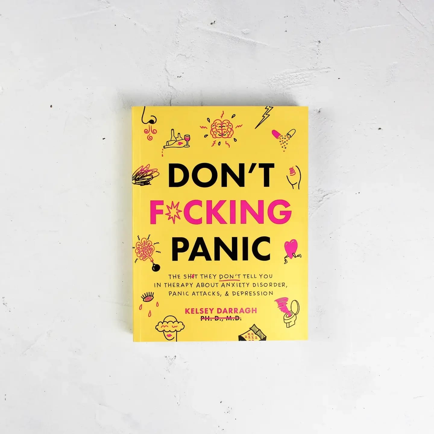 Don't F*Cking Panic - Book - "Don't F*cking Panic" is an interactive mental health workbook — 370 illustrated pages covering the holy trinity of conditions that nobody talks about honestly enough: anxiety disorder, panic attacks, and depression. Not the sanitized version. The real version. The wave of digestive chaos after a panic attack. The passive thought of wanting to disappear sometimes. The 3am certainty that you're going crazy. The exhausting performance of being fine when your brain is running a five-alarm disaster drill inside your chest.  Darragh covers all of it — because she has lived all of it — and she does it with the specific combination of radical honesty and genuine humor that has made her one of the most trusted voices in the mental health space online. This is not a book that talks down to you, wraps your anxiety in euphemisms, or sends you away with a breathing exercise and a motivational quote. It is a workbook built for the moments when you actually need something to grab onto.