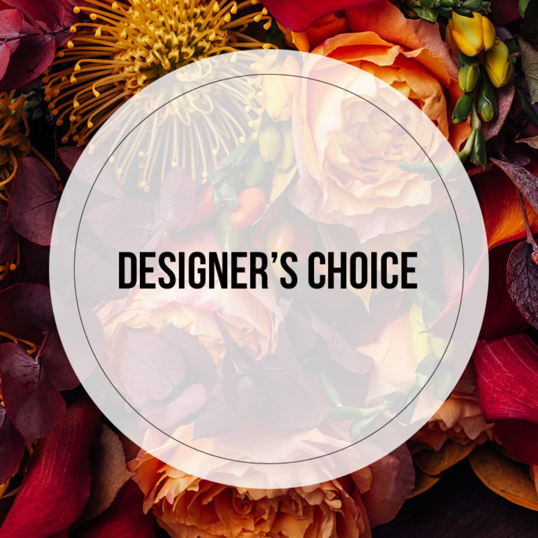 Designer’s choice floral arrangement with orange and burgundy blooms