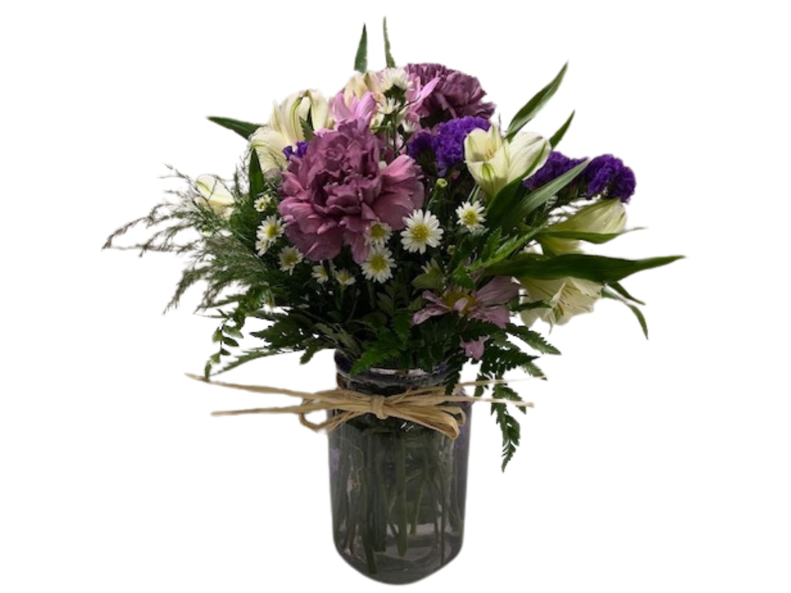 Mixed bouquet of purple and white flowers in a glass vase