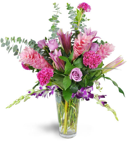 Pink and purple mixed bouquet in a clear glass vase