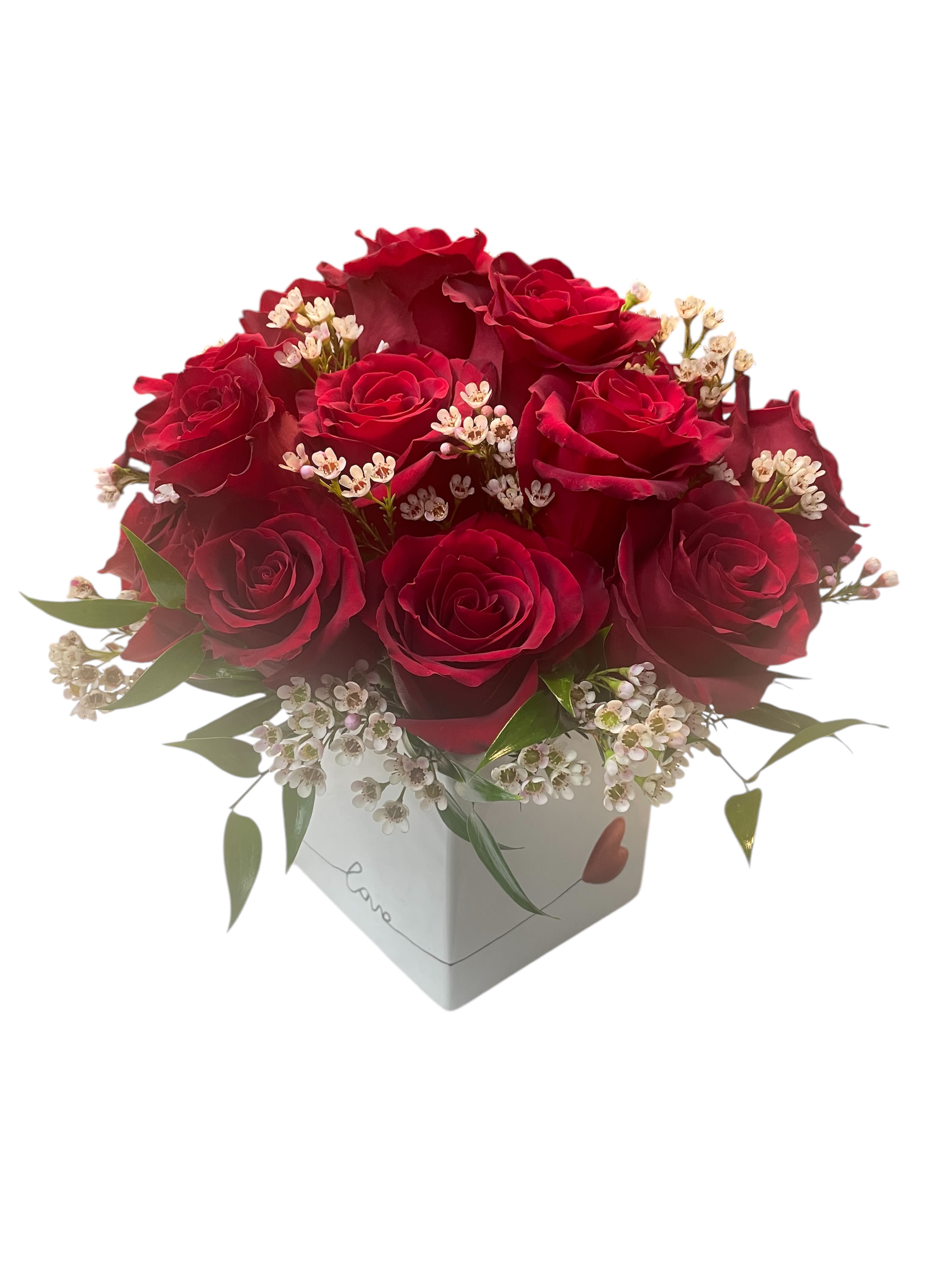 Red roses arranged in a white box with small white filler flowers