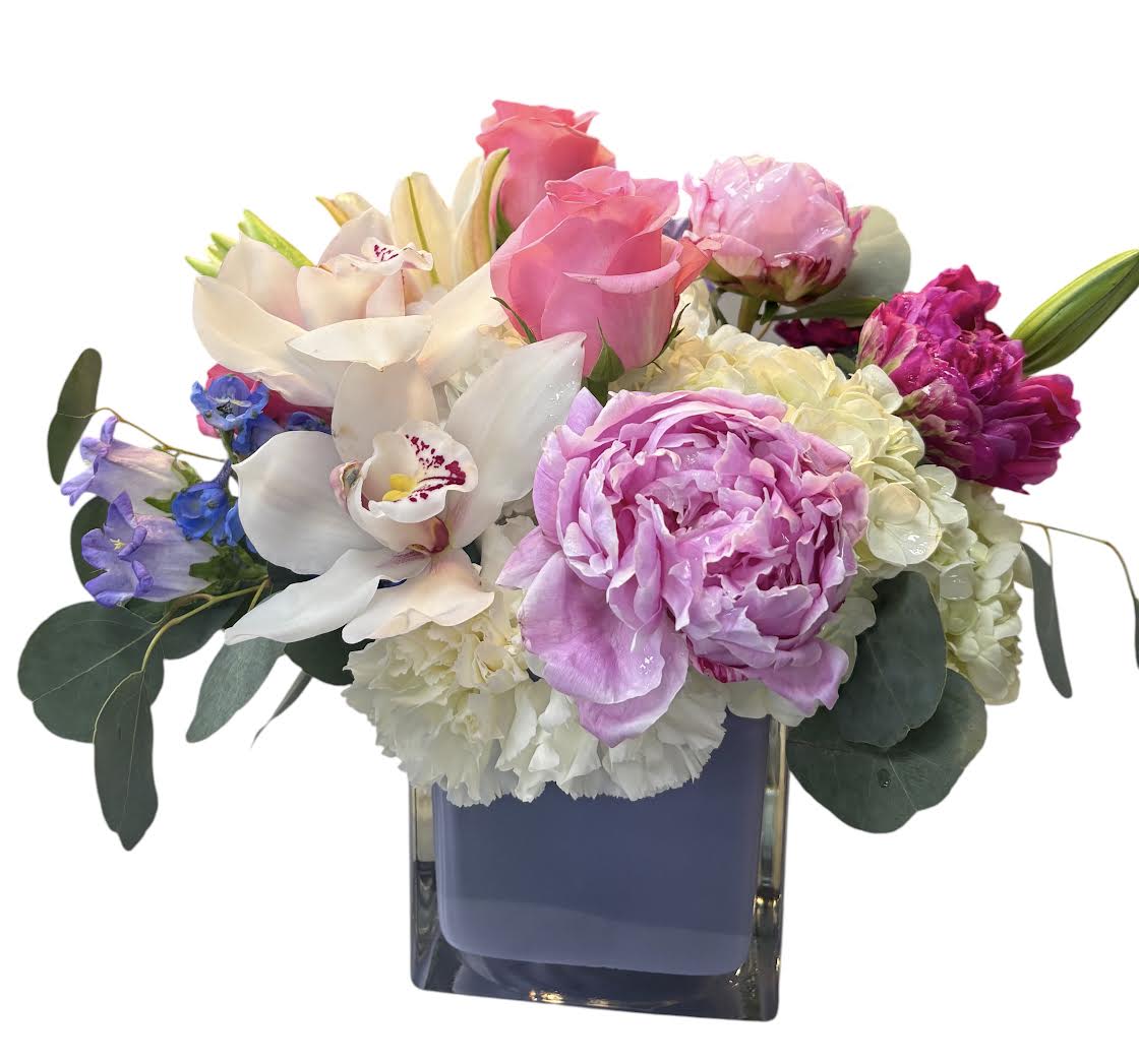 Grateful Garden for Mom - Let them know how much you appreciate them with our Grateful Garden arrangement!    Substitution Policy In some instances, our photo may represent an overall theme or look and include a one-of-a-kind vase which cannot be exactly replicated.  Although the actual bouquet may not precisely match the photo, its temperament will. Occasionally, substitutions of flowers and/or containers happen due to weather, seasonality and market conditions which may affect availability. If this is the case with the gift you’ve selected, we will ensure that the style, theme and color scheme of your arrangement is preserved and will only substitute items of equal value or higher value.  If any design elements are of major importance to your order, please include them in the florist instructions at checkout or contact us to ensure availability.