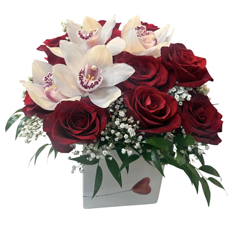 Timeless Signature Romance - Premium deep red roses paired with creamy white orchids come together in a compact, rounded bouquet that instantly conveys romance. It’s an ideal choice for anniversaries, Valentine’s Day, Mother’s Day, or simply as a meaningful everyday gesture to show someone how much they’re appreciated. The timeless red-and-white palette adds a touch of classic elegance, making the moment truly special.  ***Also available in pink roses upon request, subject to availability. 