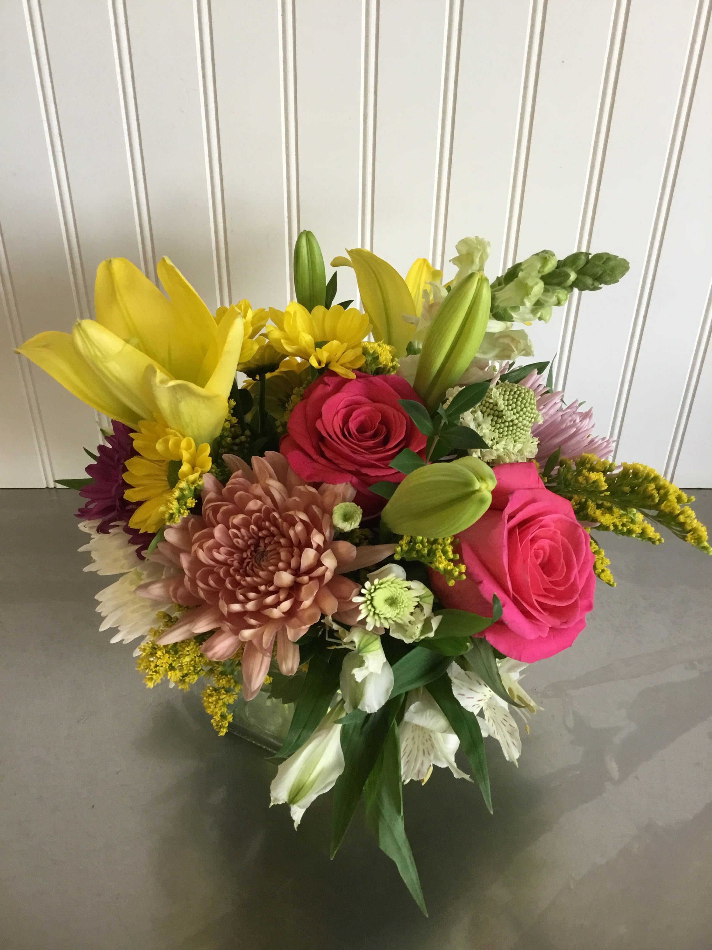 Mixed bouquet with pink roses, yellow lilies, and chrysanthemums